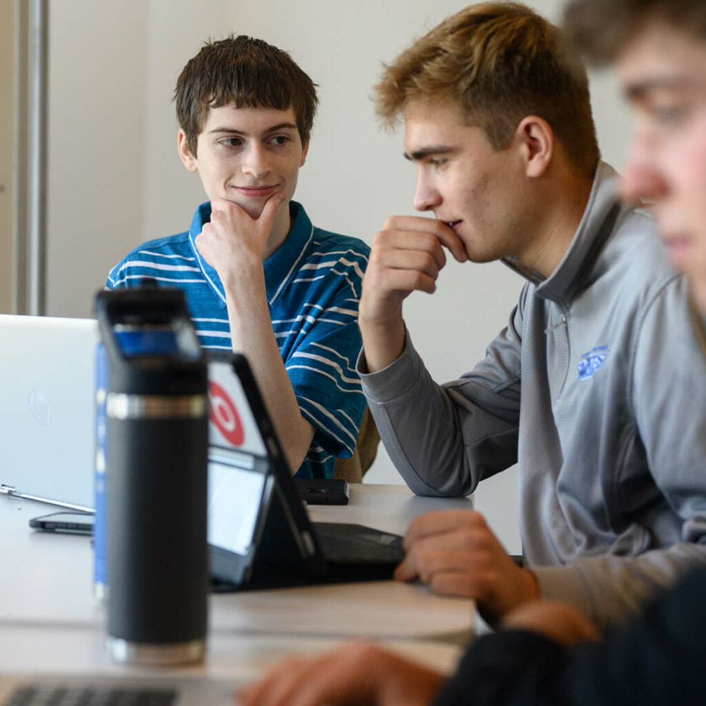 Students in a classroom setting working as a group.