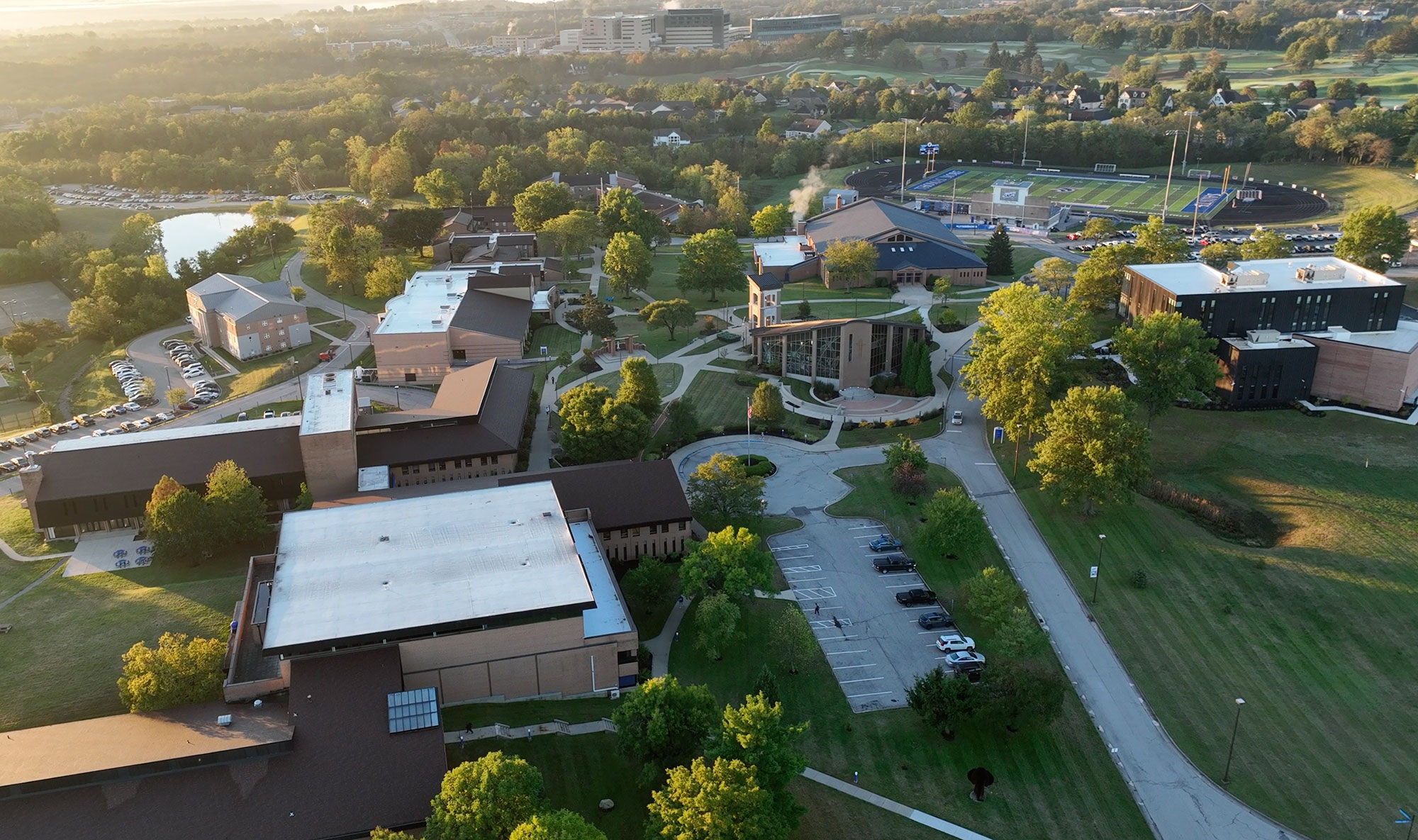 Overview of campus with the new Academic Center, Republic Bank Field, Mary, Seat of Wisdom Chapel, the Saints Center, Connor Convocation Center, and more