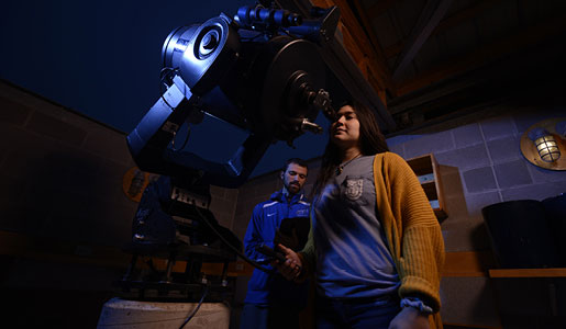 Students in the observatory making night time observations.