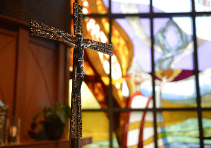 Cross and stained glass window in Mary, Seat of Wisdom Chapel