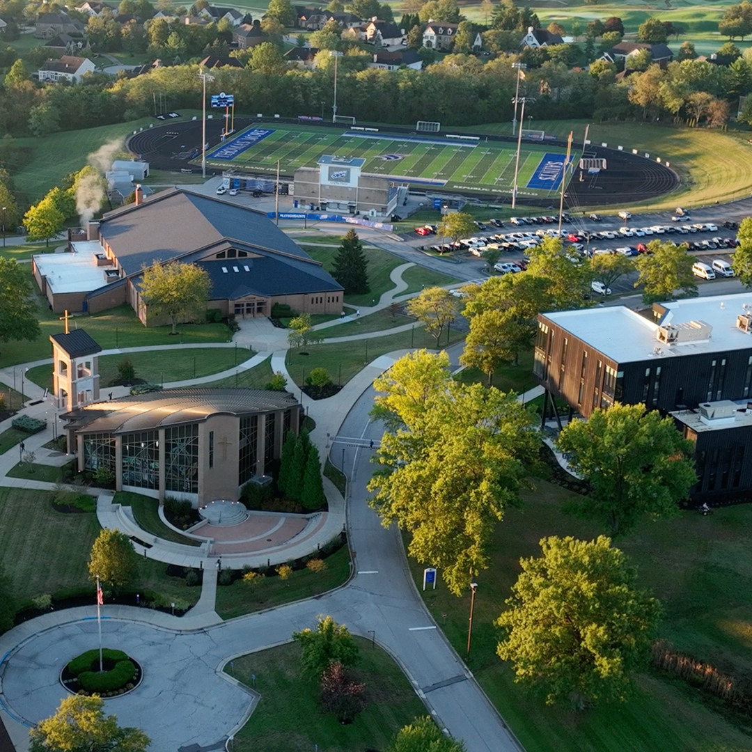 Overview of the Thomas More campus with the Mary, Seat of Wisdom Chapel, Connor Convocation Center, Republic Bank Field, and Academic Center.